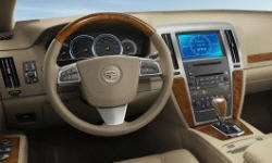 Cadillac STS vs. Hyundai Accent Fuel Economy (g/100m)