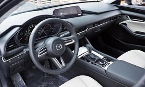 Mazda Mazda3 vs. Volkswagen Touareg Fuel Economy (km/L)