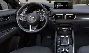 Infiniti Q50 vs. Mazda CX-5 Fuel Economy (km/L)